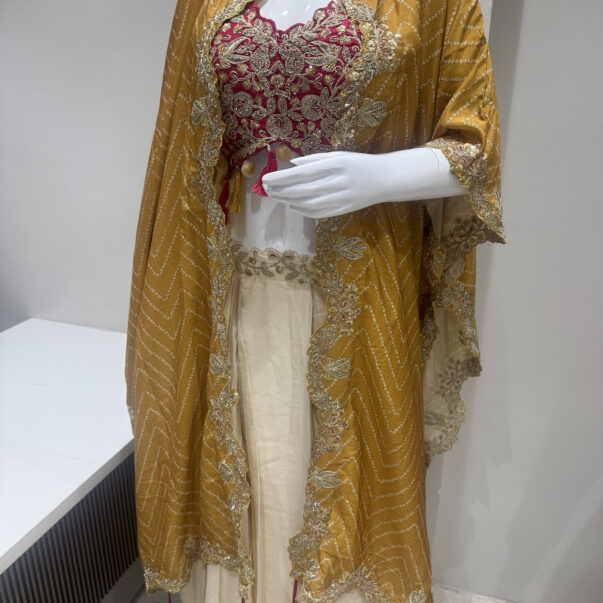 Mustard Yellow Designer Embroidered Cape with Magenta Blouse & Cream Lehenga Set
